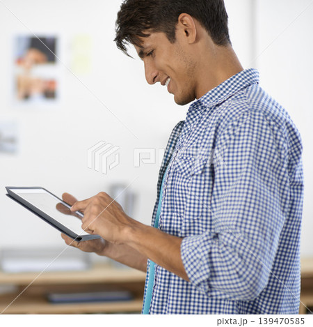 Creative, business man and scroll on tablet in office for planning research, information and social network in startup agency. Happy designer review digital news, software and app with technology Creative, business man and scroll on tablet in office for planning research, information and social network in startup agency. Happy designer review digital news, software and app with technology 139470585