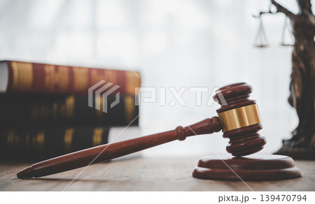 Law theme, mallet of the judge, law enforcement officers, evidence-based cases, and documents taken into account. 139470794