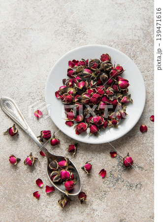 Dried rose buds creating floral herbal tea mix Dried rose buds creating floral herbal tea mix 139471616