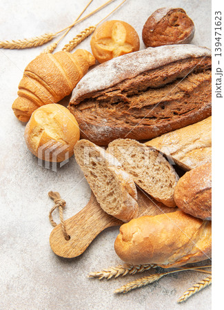 Assorted fresh bakery bread products on textured background 139471623