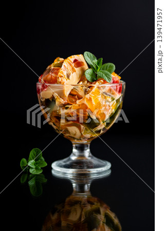 colorful gelatin dessert with coffee and fruit pieces in elegant glass colorful gelatin dessert with coffee and fruit pieces in elegant glass 139471957