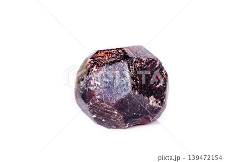 Macro of a mineral garnet stone on a white background Macro of a mineral garnet stone on a white background 139472154