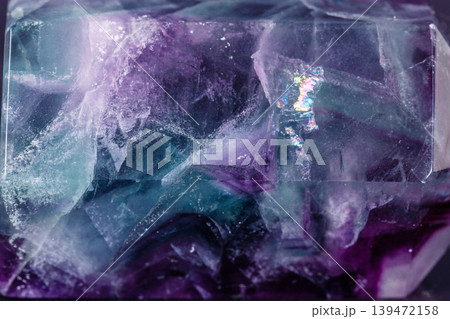 Macro mineral stone Fluorite crystal on a black background Macro mineral stone Fluorite crystal on a black background 139472158