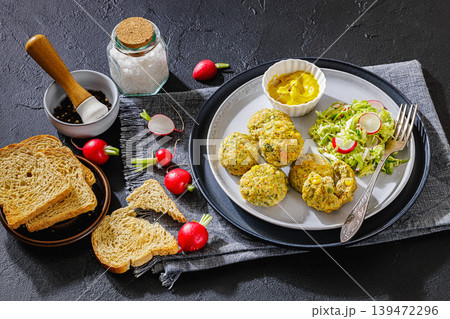 baked meat and vegetable polpette on a plate 139472296