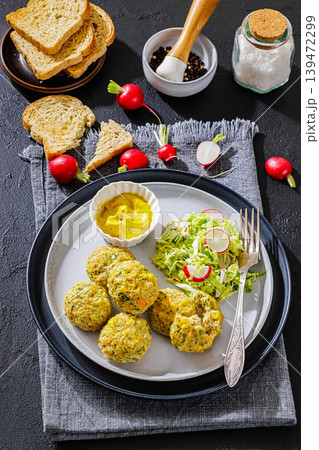 baked meat and vegetable polpette on a plate 139472299
