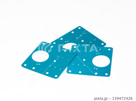Three blue metal cabinet hinge repair plates for fixing damaged wooden furniture, isolated on white background. Three blue metal cabinet hinge repair plates for fixing damaged wooden furniture, isolated on white background. 139472426