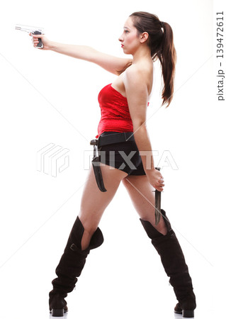 Sexy young woman - gun isolated on white 139472611