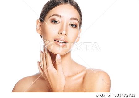 Young beautiful woman looking at the camera. Portrait woman with fresh smooth clean skin Young beautiful woman looking at the camera. Portrait woman with fresh smooth clean skin 139472713
