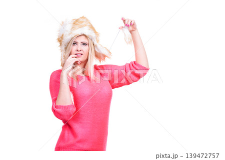 Attractive woman wearing furry winter hat 139472757