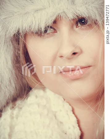 Blonde woman in winter furry hat Blonde woman in winter furry hat 139472771