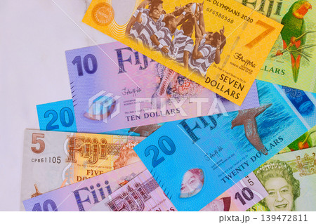 Different currency notes from Fiji dollar are arranged on various values designs. Different currency notes from Fiji dollar are arranged on various values designs. 139472811