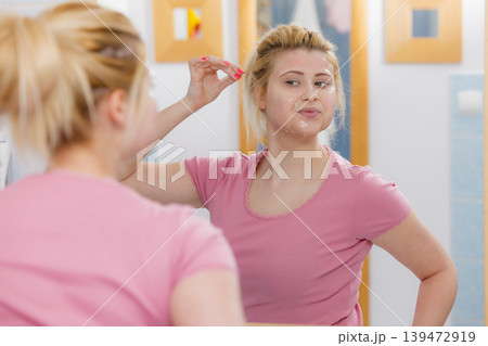 Young woman having gel mask on face Young woman having gel mask on face 139472919