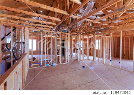 Workers build beams structure of house with wooden frames open spaces Workers build beams structure of house with wooden frames open spaces 139473040