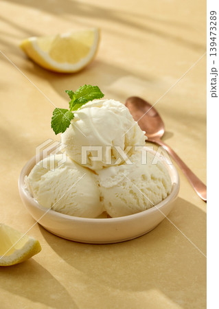 Lemon gelato ice cream with mint leaves in bowl 139473289