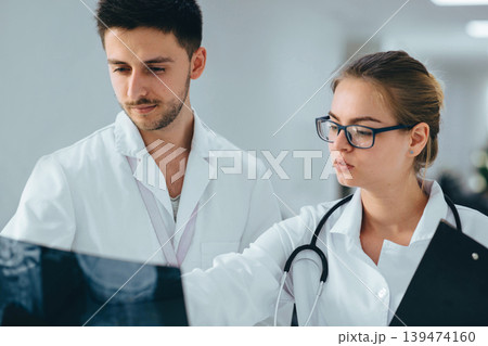 group of medical students practising at clinic group of medical students practising at clinic 139474160