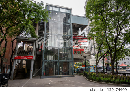 New york, usa august 17,2024. Roosevelt island tramway station displaying entrance signage and modern glass architecture, offering urban transport in new york city New york, usa august 17,2024. Roosevelt island tramway station displaying entrance signage and modern glass architecture, offering urban transport in new york city 139474409