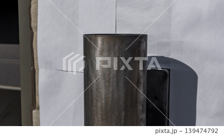 Metal paint can positioned against a backdrop of white paper, showcasing a smooth surface and ready for outdoor painting applications Metal paint can positioned against a backdrop of white paper, showcasing a smooth surface and ready for outdoor painting applications 139474792
