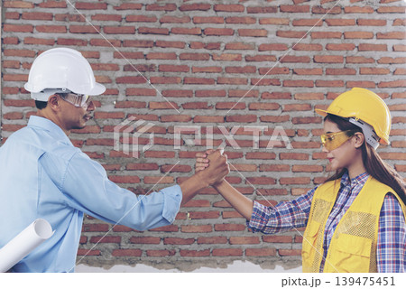 Group of multiracial people Teamwork meeting join hands Engineer Manager Foreman fist bump together. Close up diversity engineer people hands partner teams. Business connection team join partnership Group of multiracial people Teamwork meeting join hands Engineer Manager Foreman fist bump together. Close up diversity engineer people hands partner teams. Business connection team join partnership 139475451