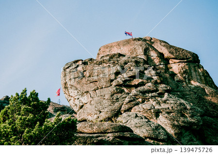 Landscape of Siberia mountains Stolbi, rock peak range in haze summer 139475726