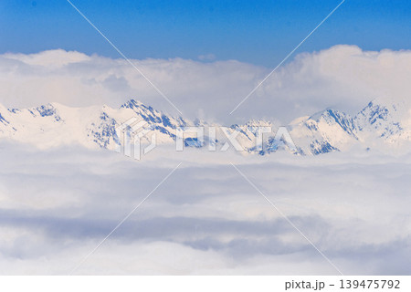 Landscape of snowy Russia Sochi mountains, peaks in haze winter Krasnaya Polyana Landscape of snowy Russia Sochi mountains, peaks in haze winter Krasnaya Polyana 139475792