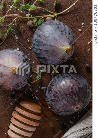 Fresh ripe figs on a wooden table. Healthy Mediterranean figs. Beautiful blue purple figs, selective focus. Fresh ripe figs on a wooden table. Healthy Mediterranean figs. Beautiful blue purple figs, selective focus. 139476803