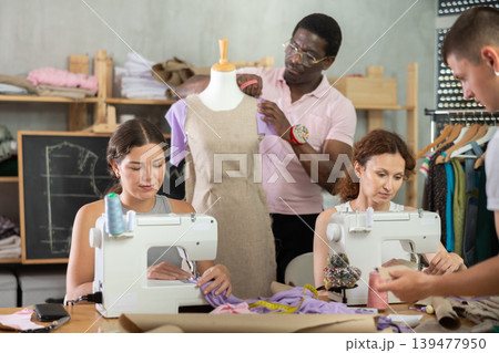 Group of students participating dressmaking class in tailor workshop 139477950