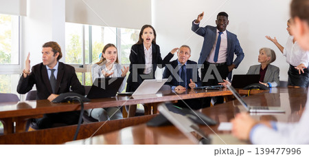 Managers expressing dissatisfaction with teamwork of colleagues at meeting Managers expressing dissatisfaction with teamwork of colleagues at meeting 139477996