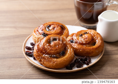 French Pain au Raisin, Cinnamon Raisin Swirl and hot coffee French Pain au Raisin, Cinnamon Raisin Swirl and hot coffee 139479163