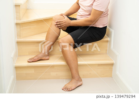 Asian lady woman patient fall down the stairs because slippery surfaces. Asian lady woman patient fall down the stairs because slippery surfaces. 139479294