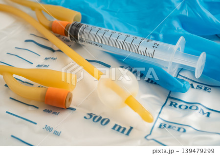 Foley urinary catheter with urine bag for disability or patient in hospital. 139479299