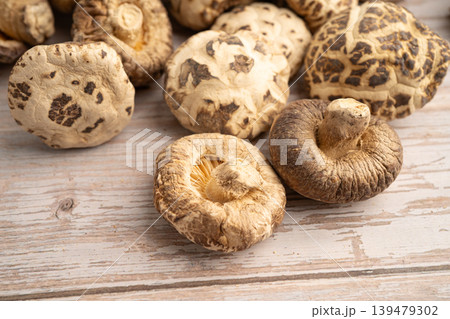 Dried shiitake mushroom on wooden background. healthy food. Dried shiitake mushroom on wooden background. healthy food. 139479302