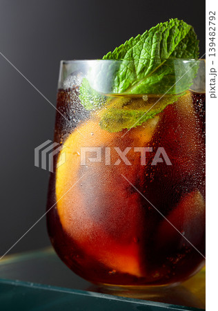Cocktail with lemon, ice and mint in misted glass. 139482792