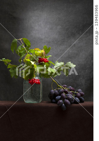 Still life with ripe grapes and red viburnum branches Still life with ripe grapes and red viburnum branches 139483966