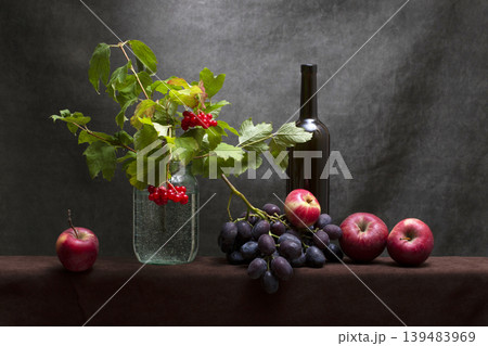 Still life with ripe grapes and red viburnum branches 139483969