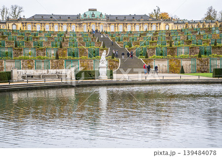 Sanssouci park in Potsdam, Germany. Old garden stairs building architecture. Nature outdoor landscape Pond Fontaine Sanssouci park in Potsdam, Germany. Old garden stairs building architecture. Nature outdoor landscape Pond Fontaine 139484078