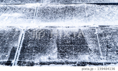 Solar panels on a roof in the snow in winter. Cleaning panel 139484136