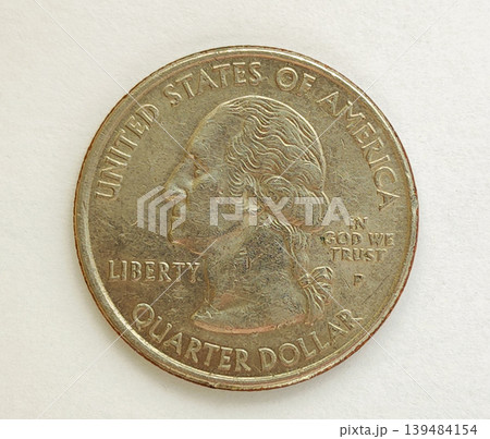 A quarter dollar coin on a white isolated background. George Washington's profile 139484154