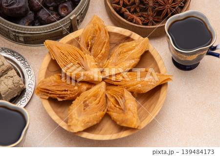Crimean Tatar Baklava, a traditional pastry in bowl. Sweet diamond shapes food Crimean Tatar Baklava, a traditional pastry in bowl. Sweet diamond shapes food 139484173