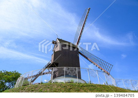 Traditional wooden windmill in Medieval Old Town and UNESCO World Culture Heritage site of Bruges in West Flanders, Belgium Traditional wooden windmill in Medieval Old Town and UNESCO World Culture Heritage site of Bruges in West Flanders, Belgium 139484705