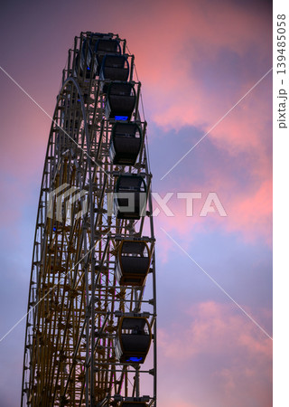 Ferris wheel silhouette at pink sunset Ferris wheel silhouette at pink sunset 139485058