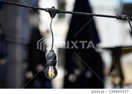 Outdoor string light bulb with bokeh background Outdoor string light bulb with bokeh background 139485417