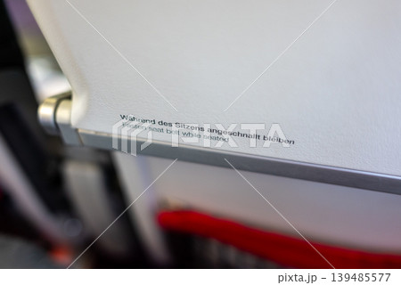 Tray table safety instruction on Austrian airlines airplane Tray table safety instruction on Austrian airlines airplane 139485577