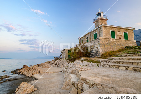 Stone St. Peter lighthouse on Adriatic sea in Makarska riviera in Croatia Stone St. Peter lighthouse on Adriatic sea in Makarska riviera in Croatia 139485589