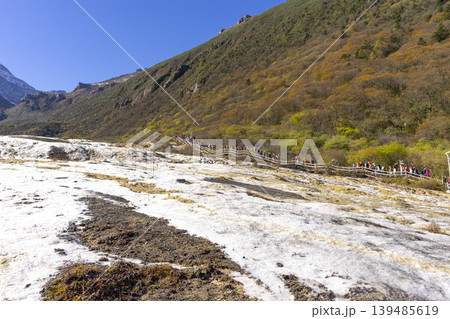 Huanglong National Park, famous for its colorful pools formed by calcite deposits in Sichuan, China. Situated at more than 3000m elevation, it is a UNESCO World heritage site. 139485619