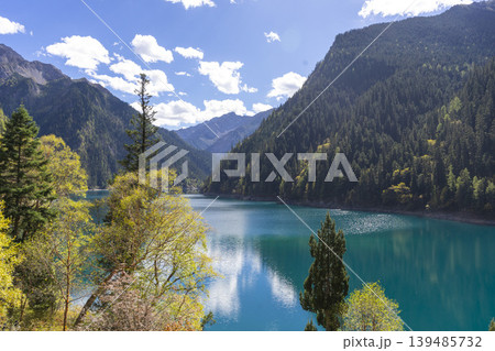Beautiful view of the Long Lake among colorful fall woods and mountains in Jiuzhai Valley National Park in China. 139485732