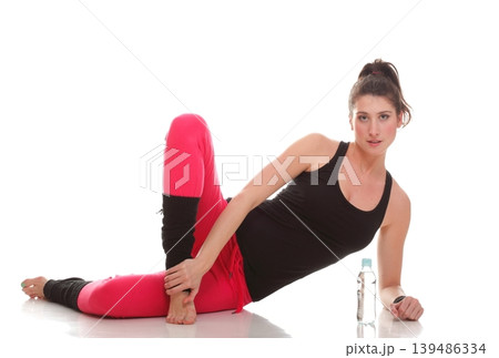 beautiful young brunette woman stretching muscles arms isolated white background beautiful young brunette woman stretching muscles arms isolated white background 139486334