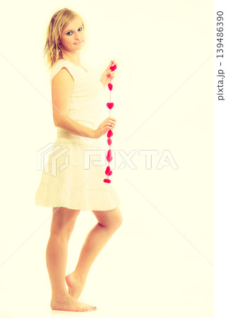 Girl with little red hearts. Girl with little red hearts. 139486390