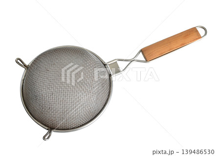 Stainless steel colander with a wooden handle. Stainless steel colander with a wooden handle. 139486530