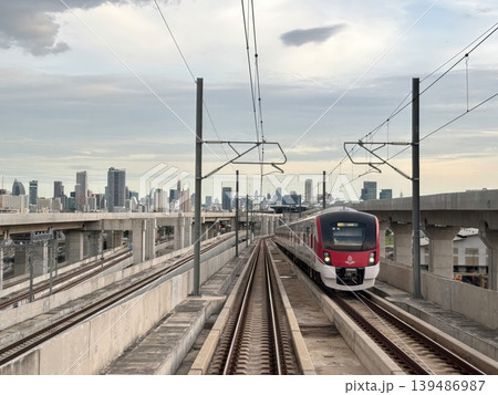 Modern SRT Red Line Commuter Train on Elevated Tracks with Bangkok Skyline Background 139486987