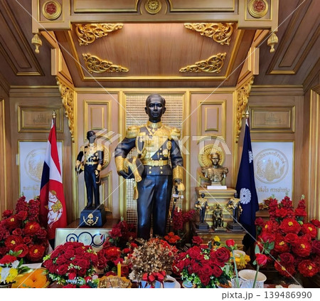 Statue of King Chulalongkorn Rama V in Ornate Shrine with Flowers and Thai Flags Statue of King Chulalongkorn Rama V in Ornate Shrine with Flowers and Thai Flags 139486990
